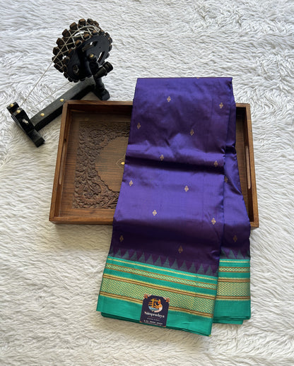 Narayanpet Silk Saree Violet Colored Complemented with a Rama Green Zari Border.