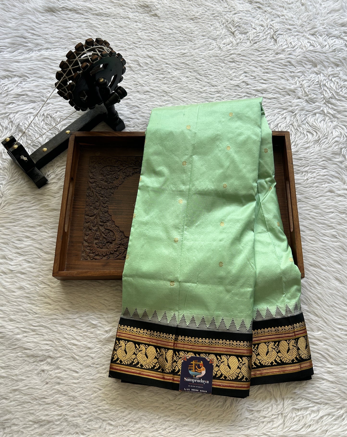 Narayanpet Silk Saree Mint Green Colored Complemented with a Black Zari Border.