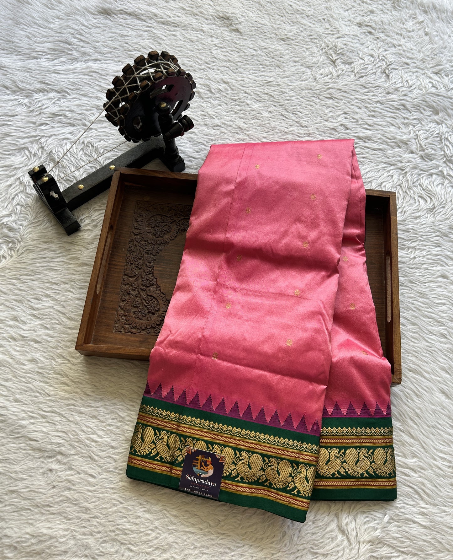 Narayanpet Silk Saree Dark Pink Colored Complemented with a Green Zari Border.