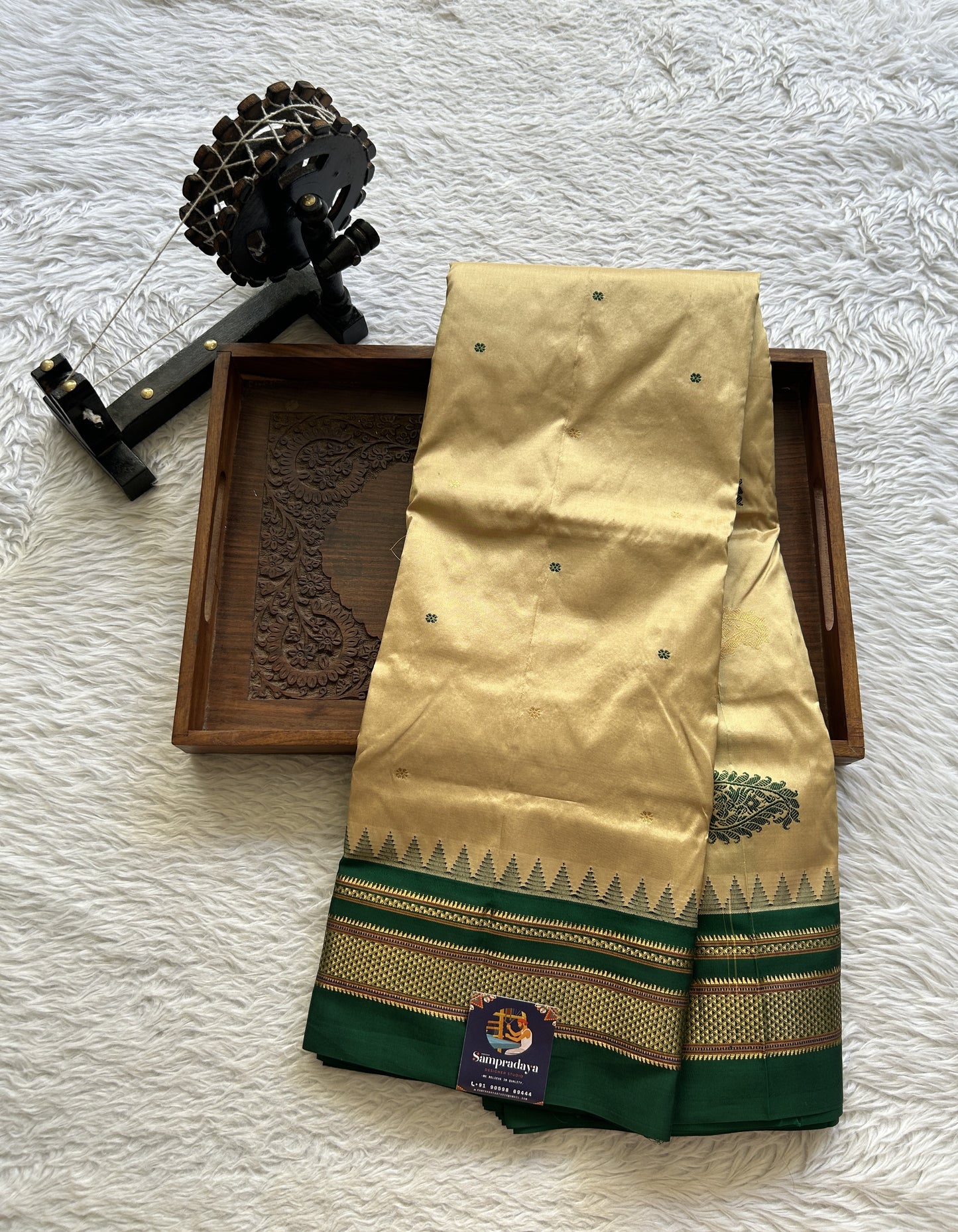 Narayanpet Silk Saree Beige Colored Complemented with a Green Zari Border.