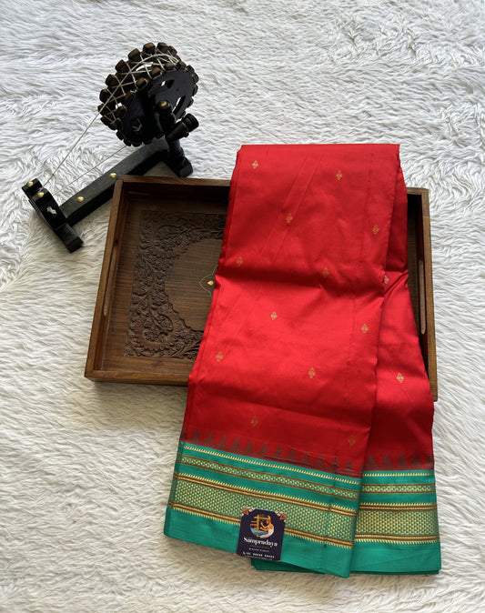 Narayanpet Silk Saree Red Colored Complemented with a Rama Green Zari Border.