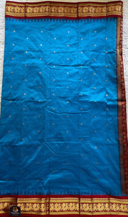 Narayanpet Silk Saree Royal Blue Colored Complemented with a Maroon Zari Border.