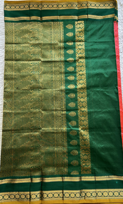 Narayanpet Silk Saree Dark Peach Colored Complemented with a Dark Green Zari Border.