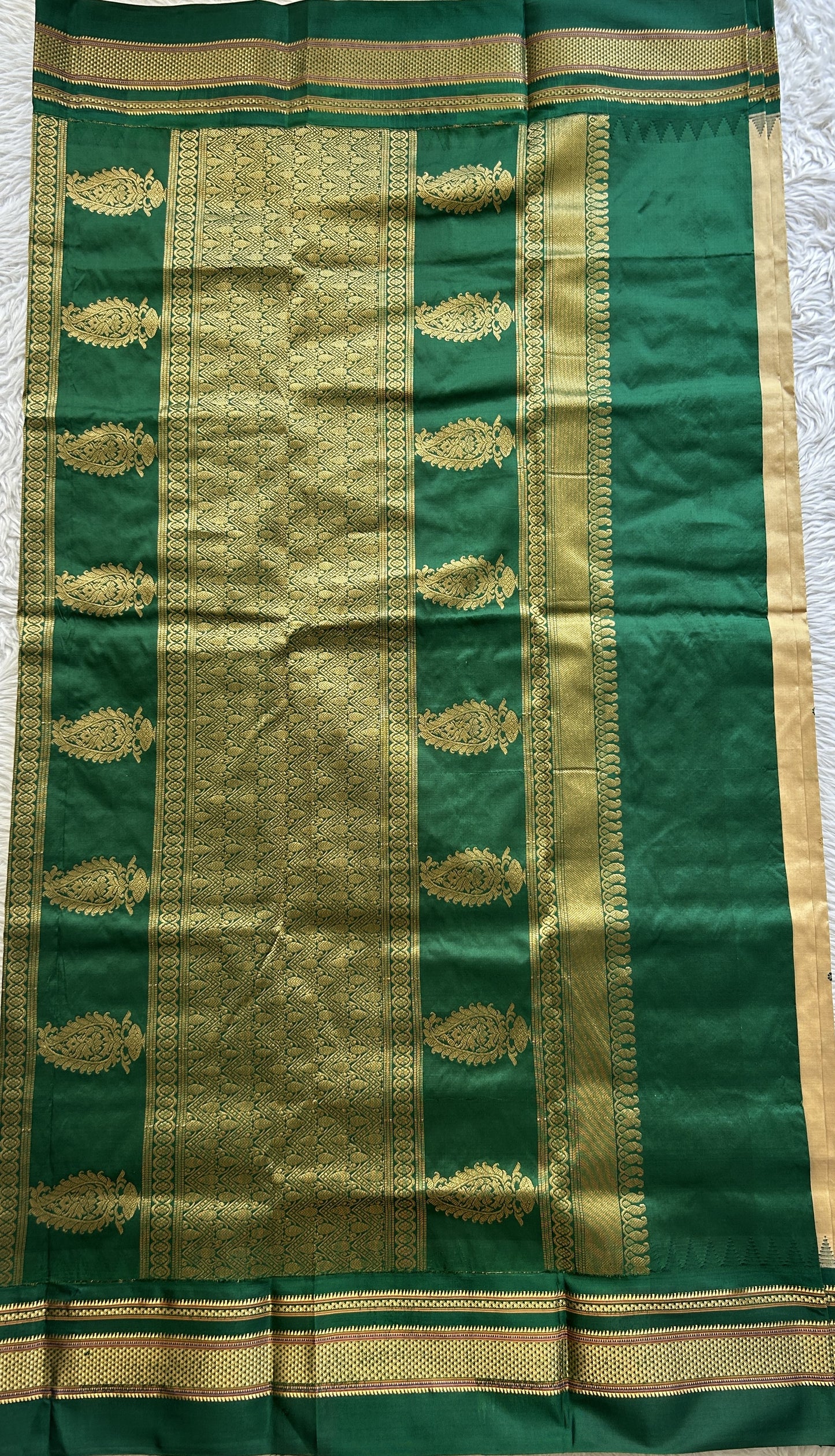 Narayanpet Silk Saree Beige Colored Complemented with a Green Zari Border.