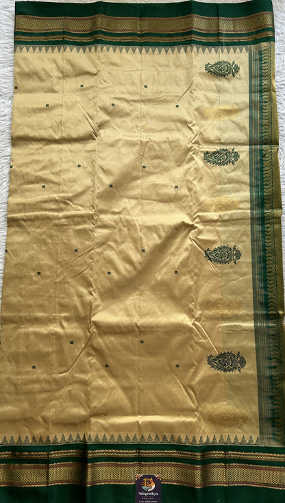 Narayanpet Silk Saree Beige Colored Complemented with a Green Zari Border.