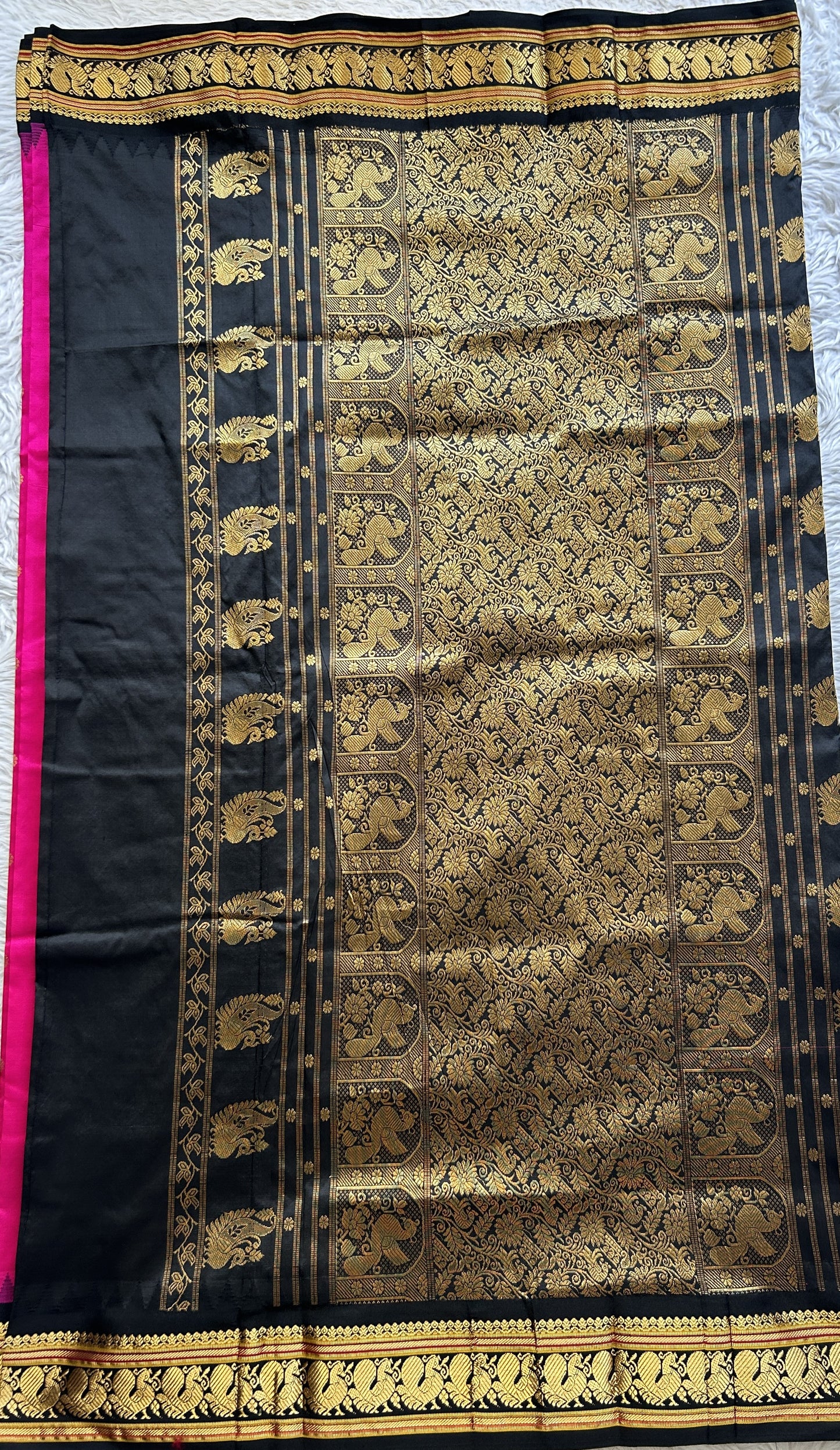 Narayanpet Silk Saree Hot Pink Colored Complemented with a Black Zari Border.