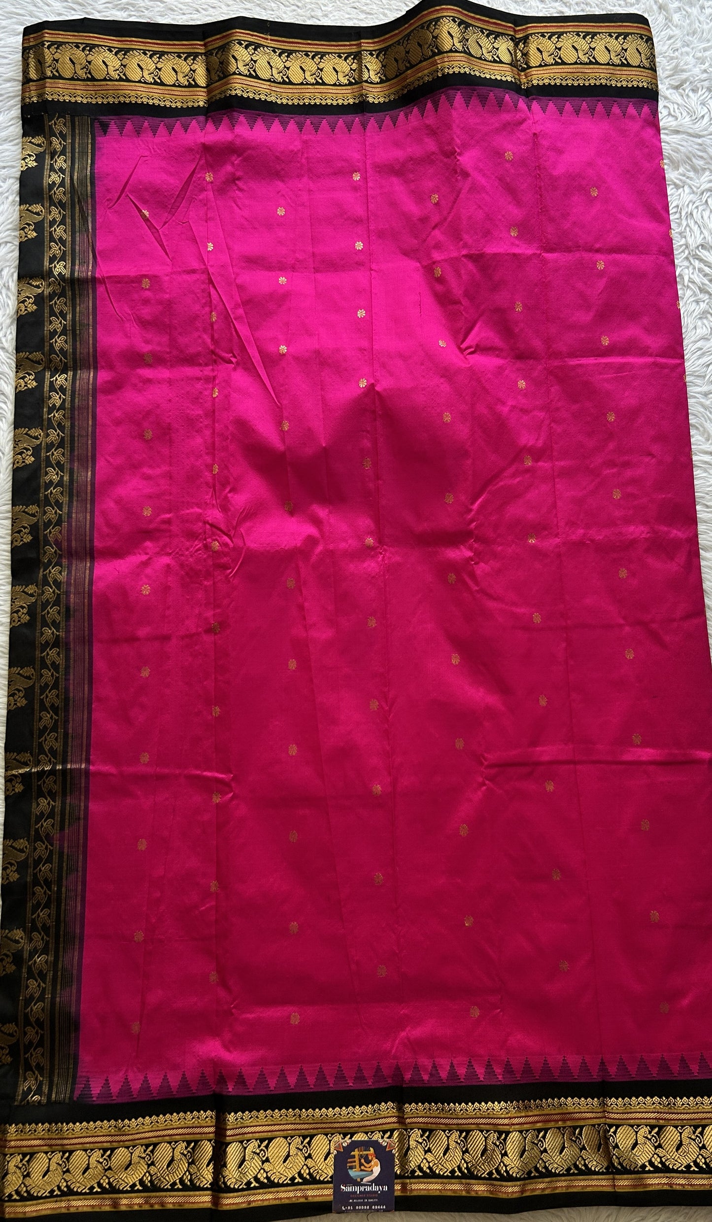 Narayanpet Silk Saree Hot Pink Colored Complemented with a Black Zari Border.