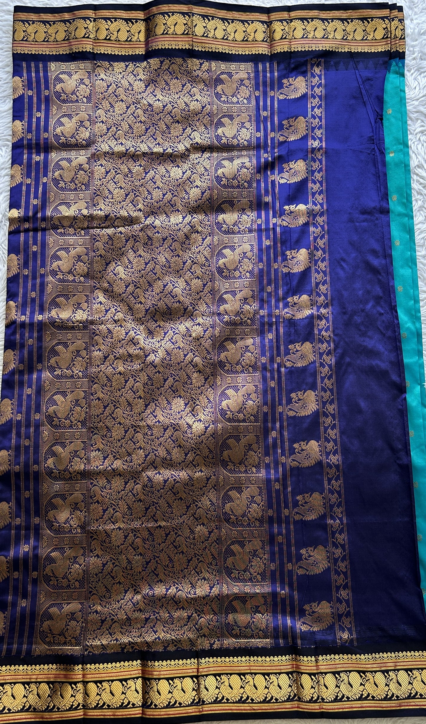 Narayanpet Silk Saree Rama Green Colored Complemented with a Navy Blue Zari Border.