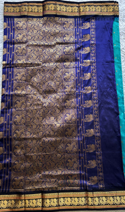 Narayanpet Silk Saree Rama Green Colored Complemented with a Navy Blue Zari Border.