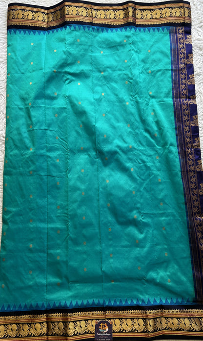 Narayanpet Silk Saree Rama Green Colored Complemented with a Navy Blue Zari Border.