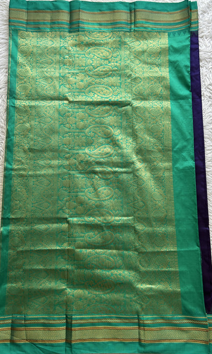 Narayanpet Silk Saree Violet Colored Complemented with a Rama Green Zari Border.