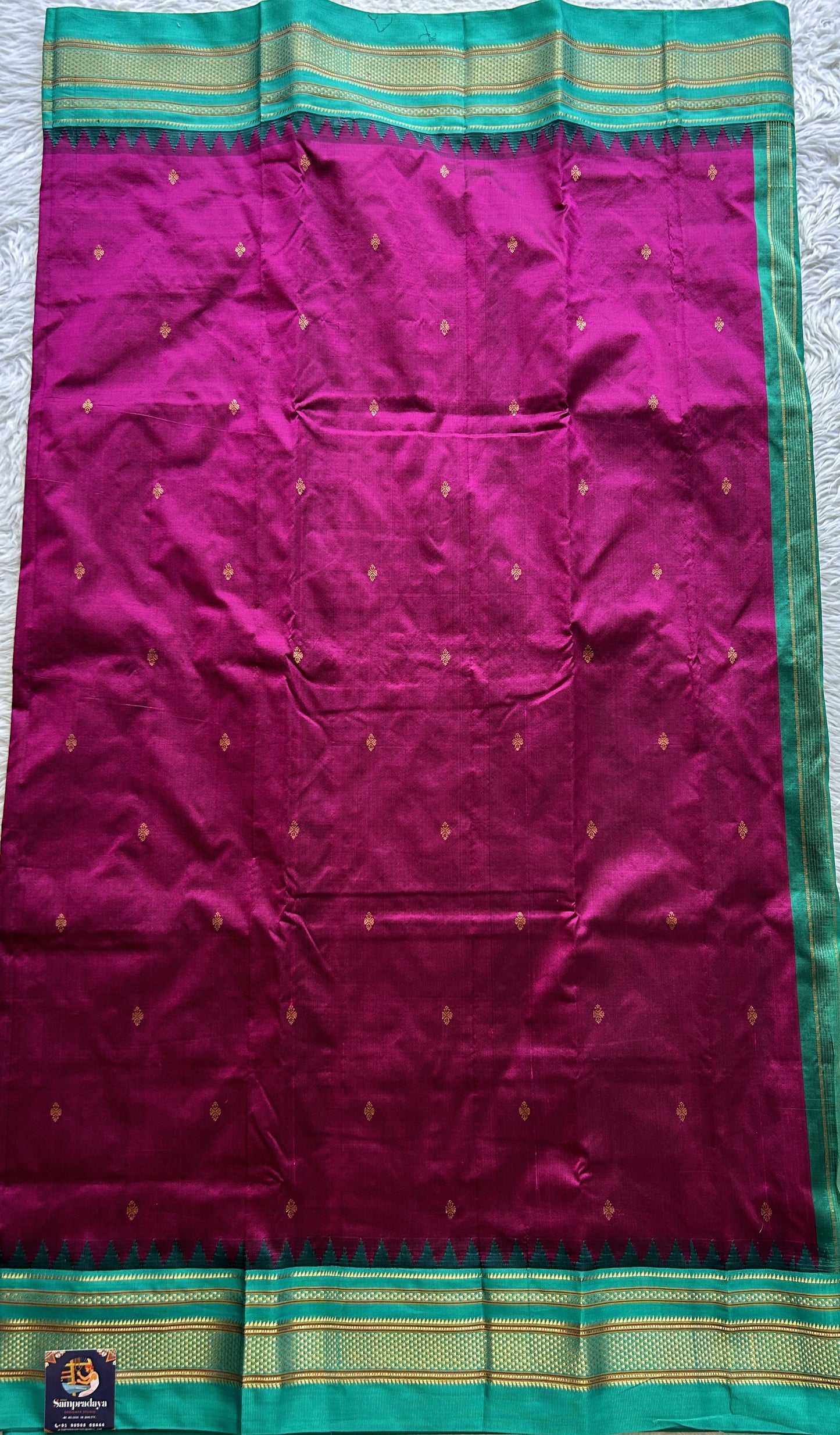 Narayanpet Silk Saree Purple Colored Complemented with a Rama Green Zari Border.