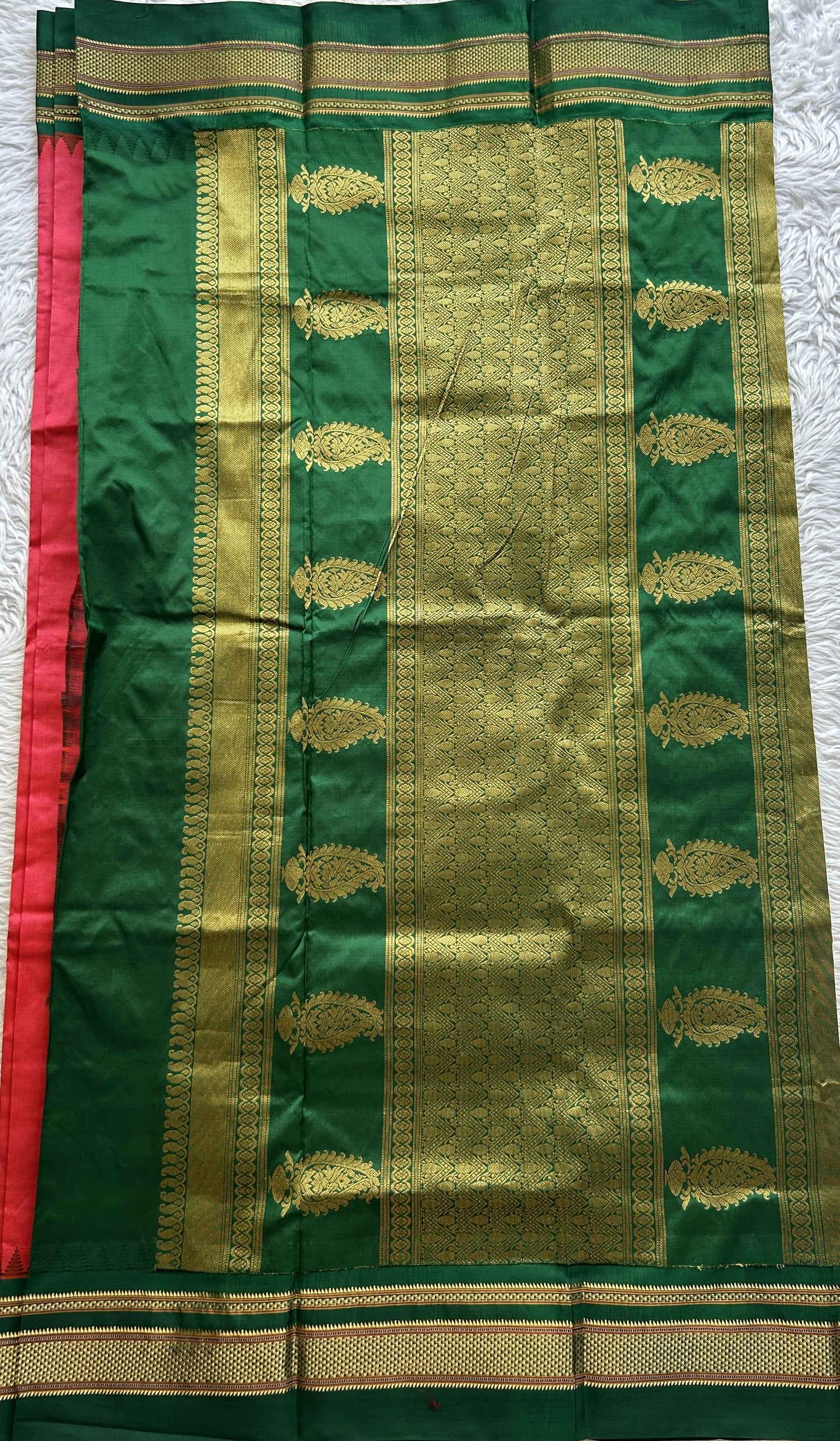 Narayanpet Silk Saree Dark Peach Colored Complemented with a Green Zari Border.