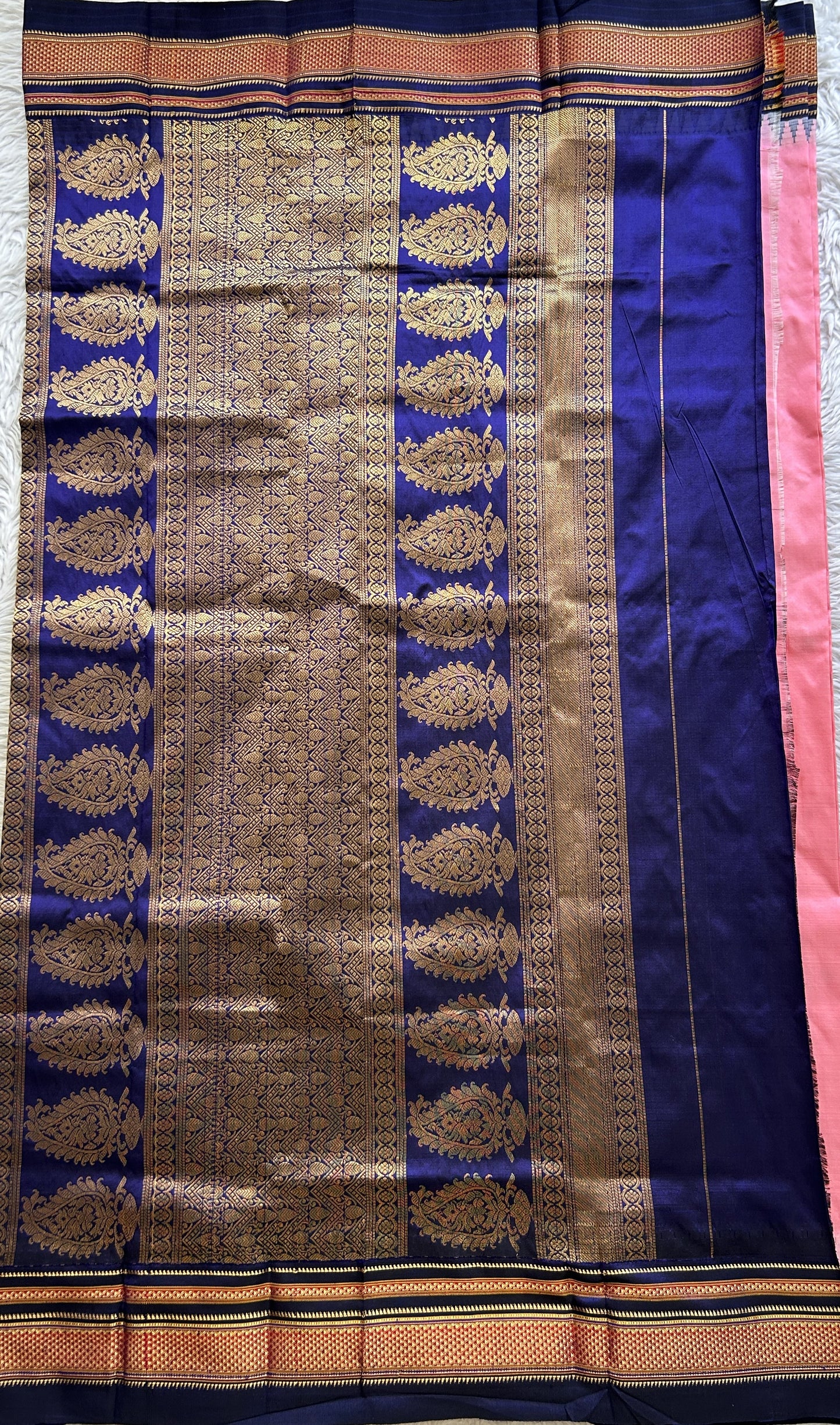 Narayanpet Silk Saree Pink Colored Complemented with a Navy Blue Zari Border.