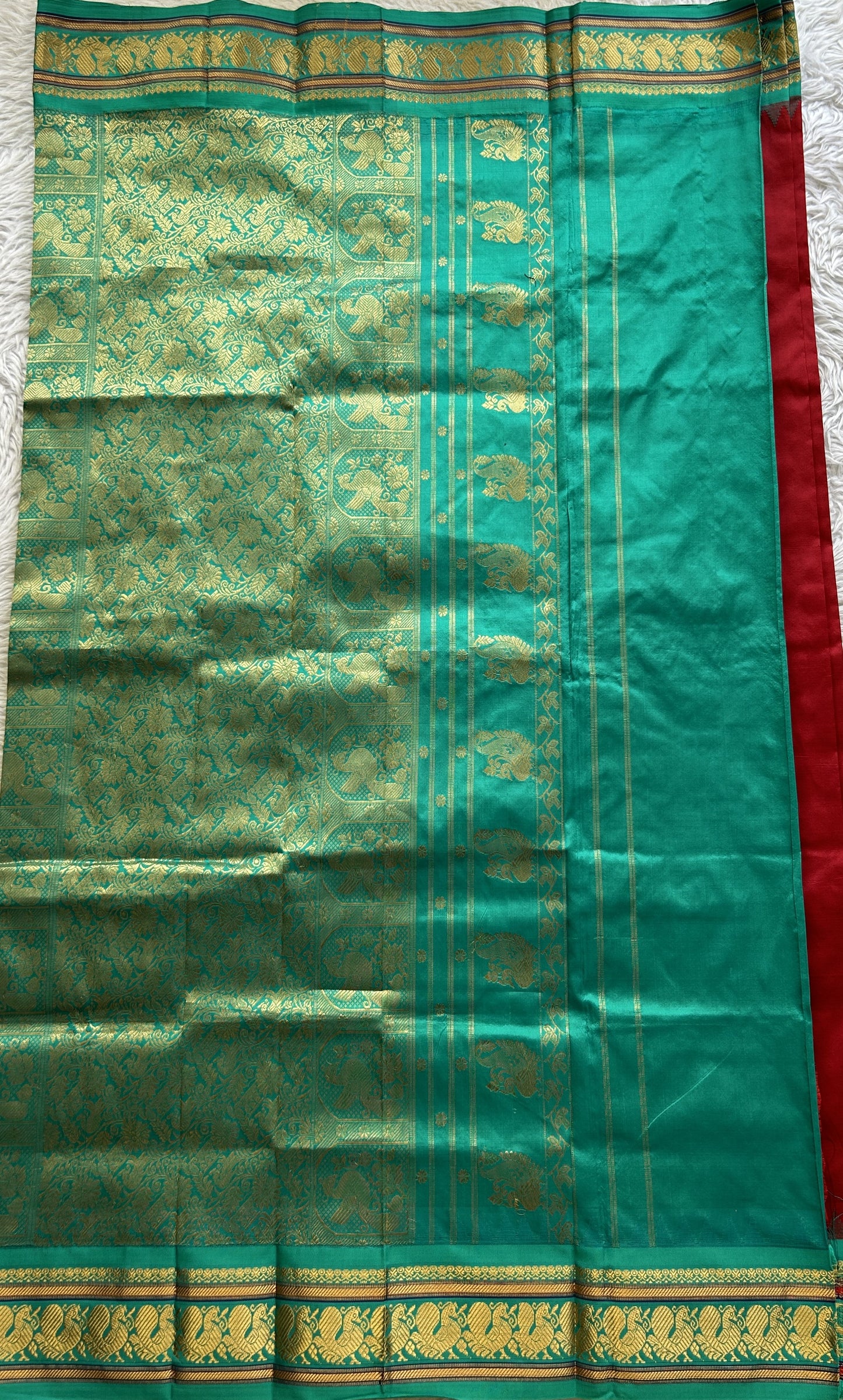 Narayanpet Silk Saree Maroon Colored Complemented with a Rama Green Zari Border.