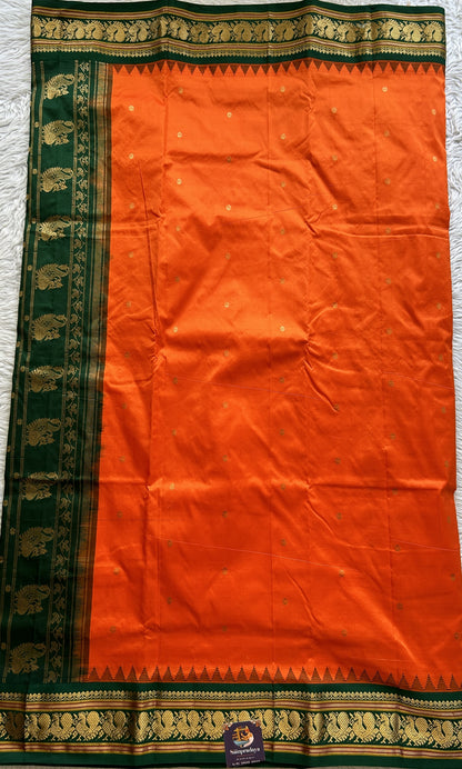 Narayanpet Silk Saree Orange Colored Complemented with a Green Zari Border.