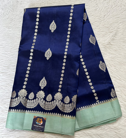 Banarasi Chiniya Silk Saree Deep Blue Colored Complemented with a Sea Blue Plain Border. - Sampradaya Designer Studio