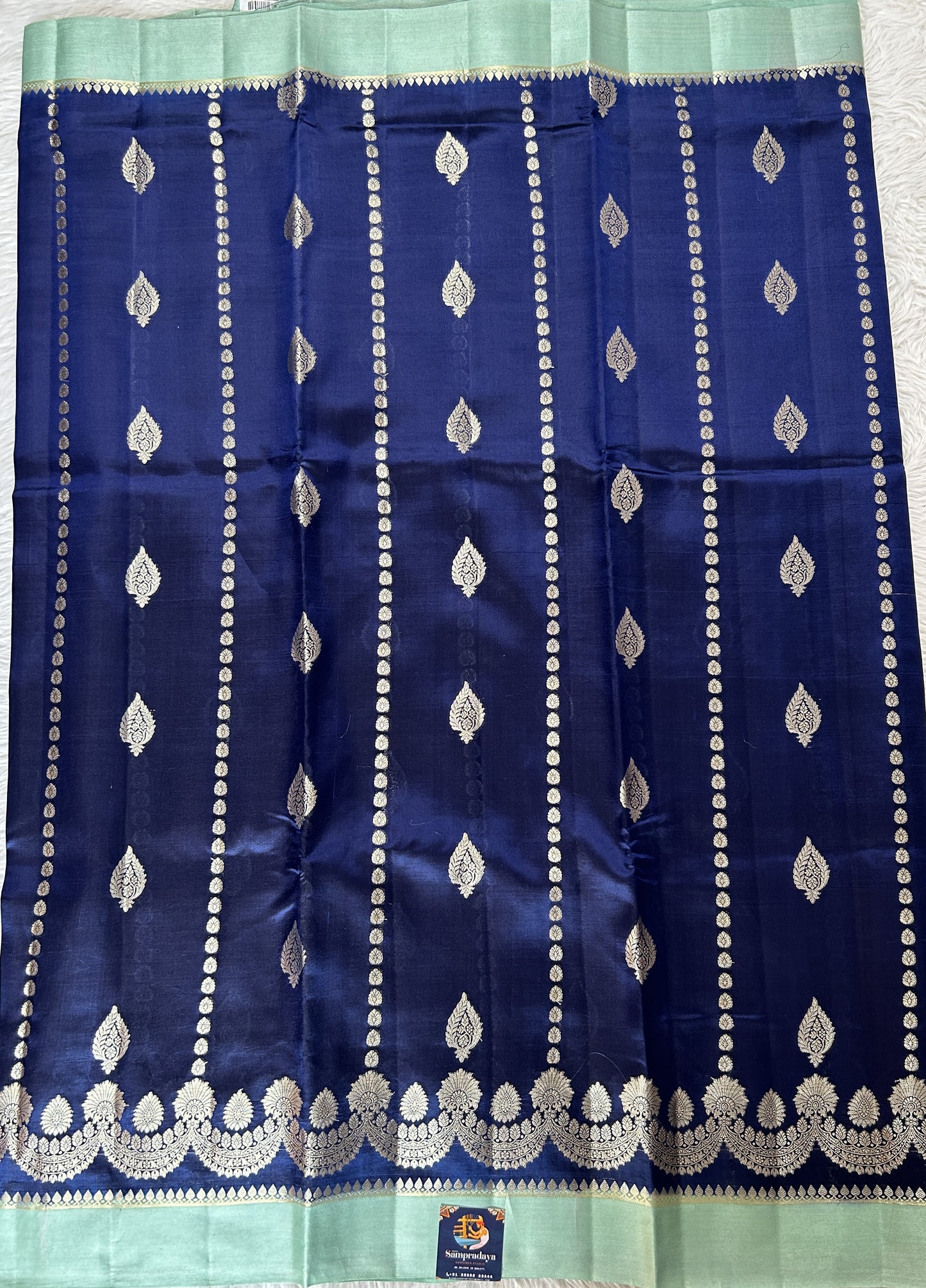 Banarasi Chiniya Silk Saree Deep Blue Colored Complemented with a Sea Blue Plain Border. - Sampradaya Designer Studio