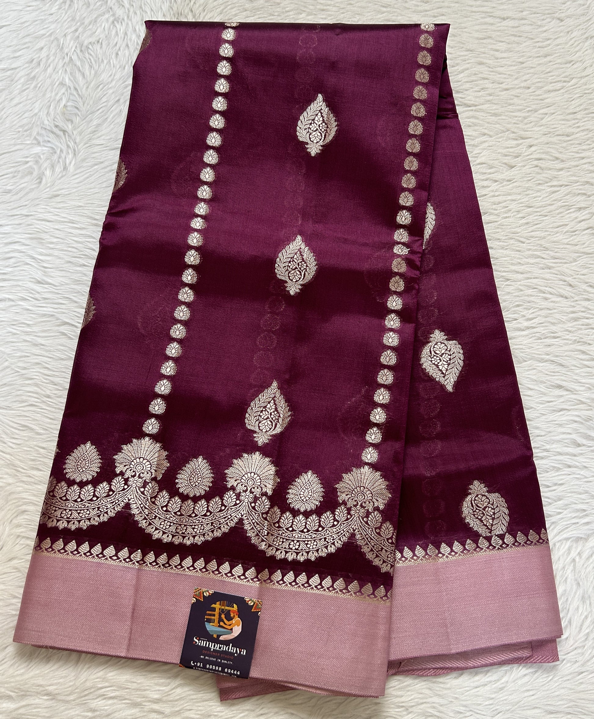 Banarasi Chiniya Silk Saree Deep Purple Colored Complemented with a Baby Pink Plain Border. - Sampradaya Designer Studio