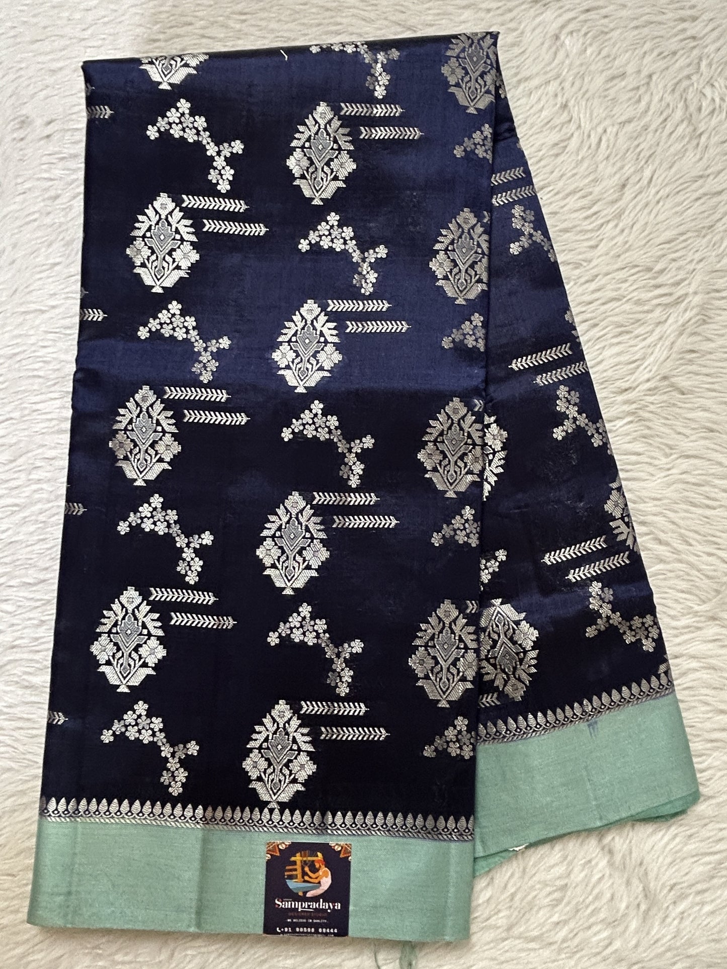 Banarasi Chiniya Silk Saree Ink Blue Colored Complemented with a Sea Blue Plain Border. - Sampradaya Designer Studio