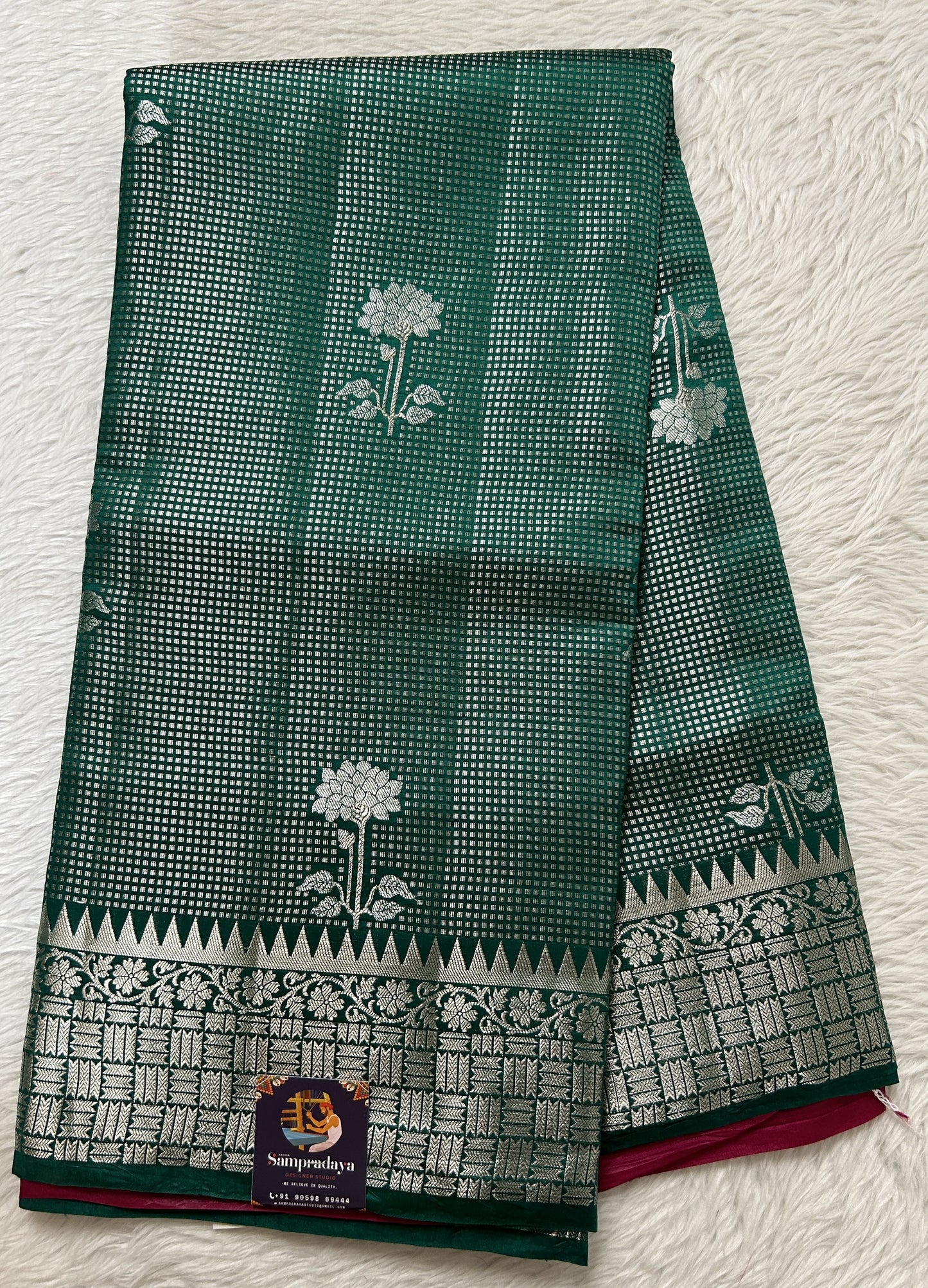 Banarasi Chiniya Silk Saree Bottle Green Colored Complemented with a Zari Border. - Sampradaya Designer Studio