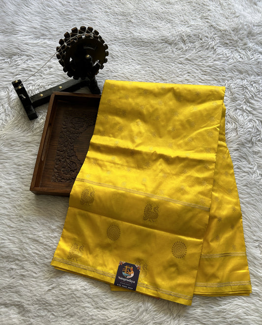 Narayanpet Silk Saree Yellow Colored Complemented with a Buti Border.