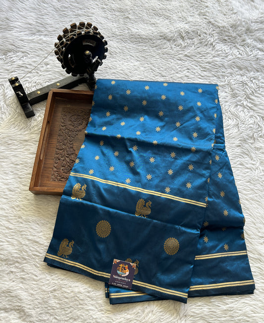 Narayanpet Silk Saree Peacock Blue Colored Complemented with a Buti Border.