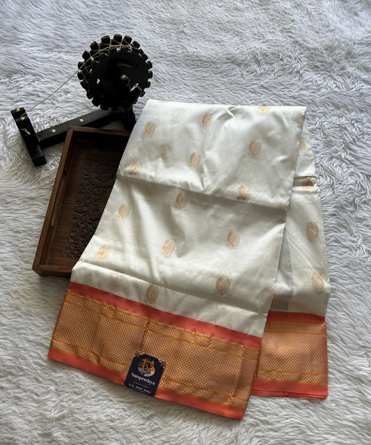 Narayanpet Silk Saree White Colored Complemented with a Peach Zari Border.