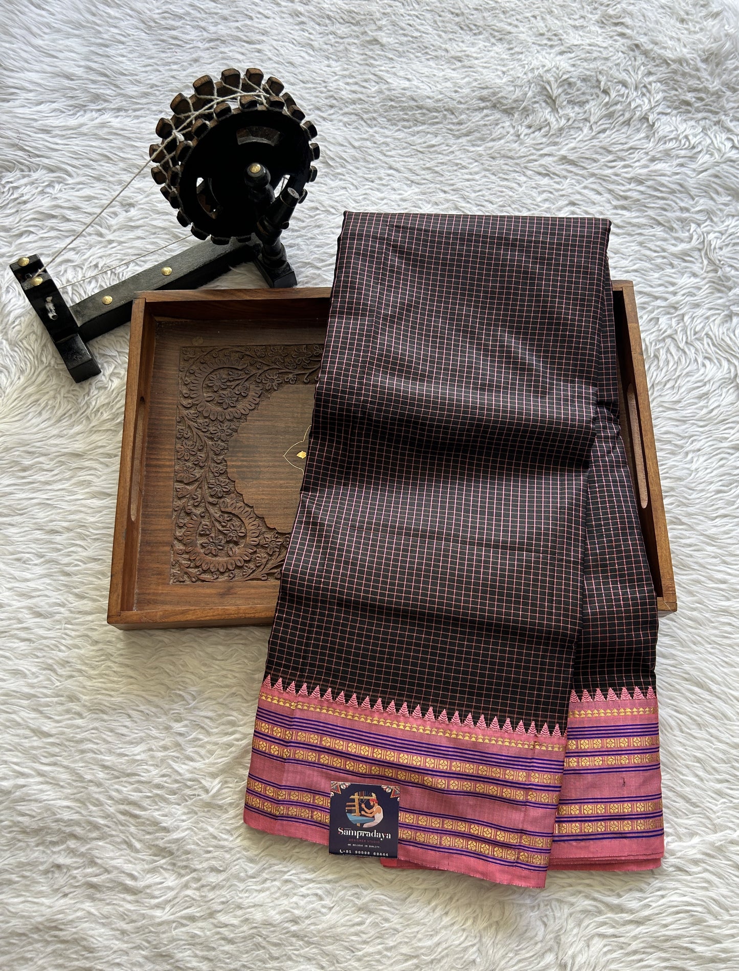 Narayanpet Silk Checks Saree Black Colored Complemented with a Peach Zari Border.