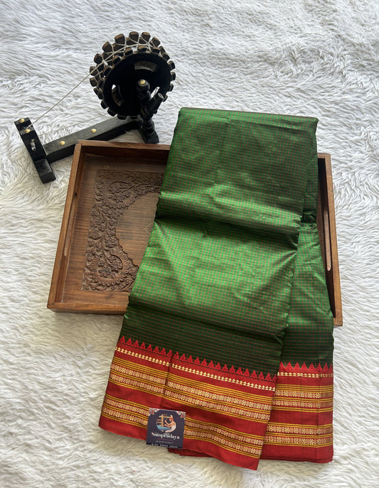 Narayanpet Silk Checks Saree Green Colored Complemented with a Red Zari Border.