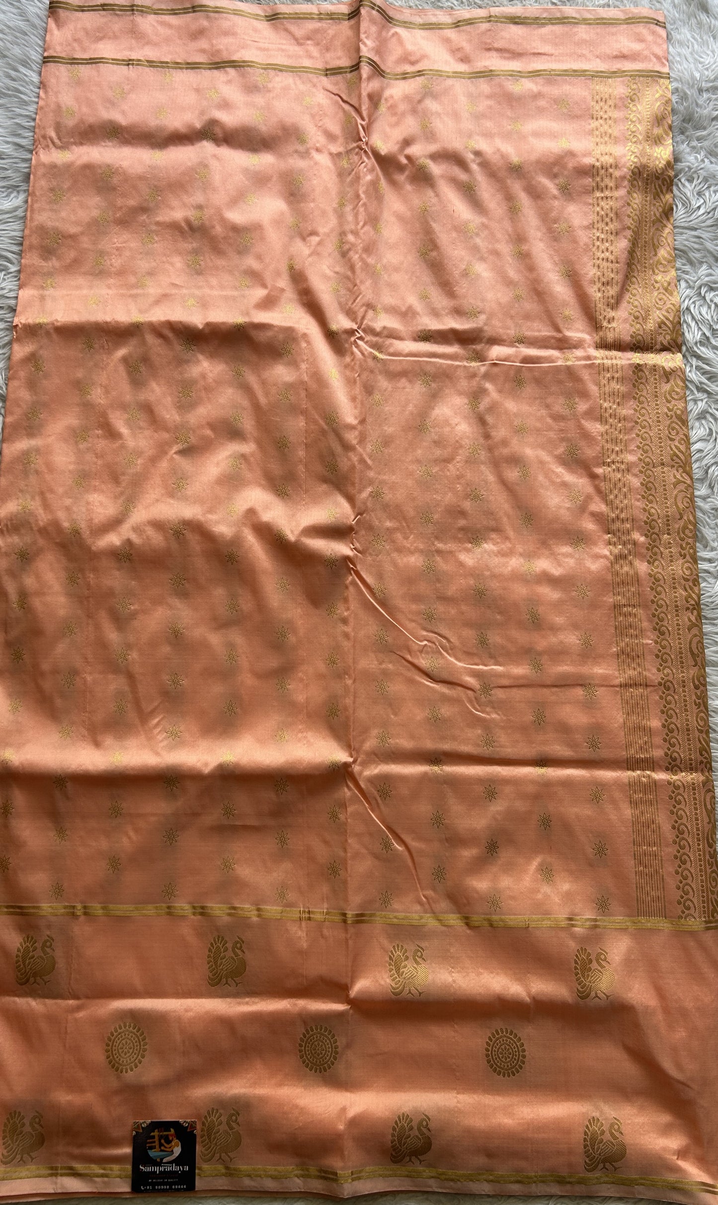 Narayanpet Silk Saree Peach Colored Complemented with a Buti Border.