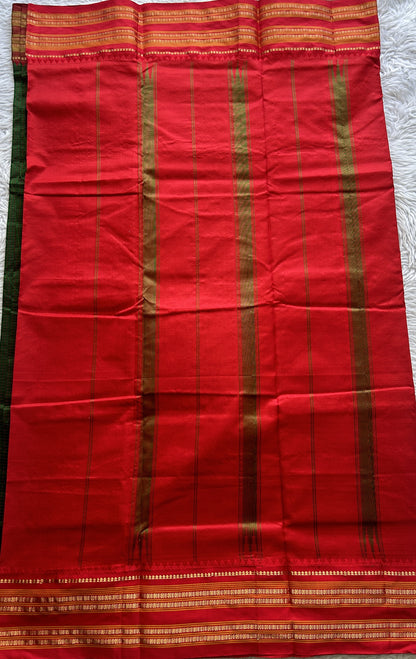 Narayanpet Silk Checks Saree Green Colored Complemented with a Red Zari Border.