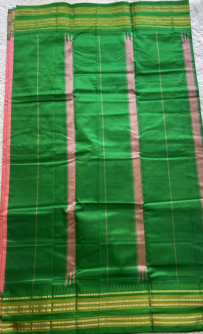 Narayanpet Silk Checks Saree Peach Colored Complemented with a Green Zari Border.