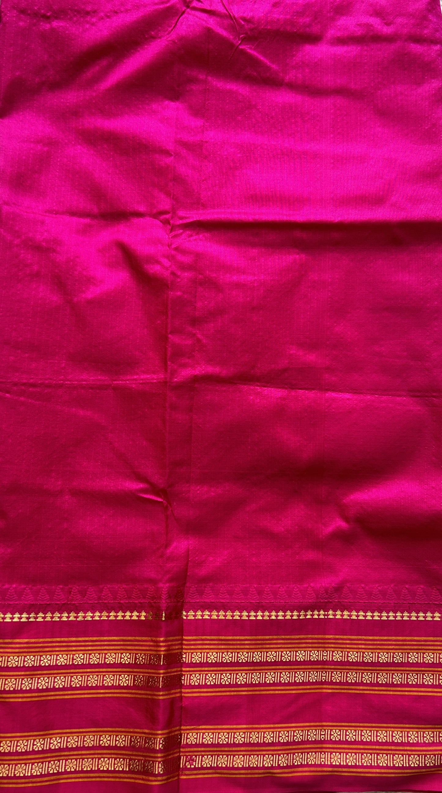 Narayanpet Silk Checks Saree Ash Colored Complemented with a Pink Zari Border.