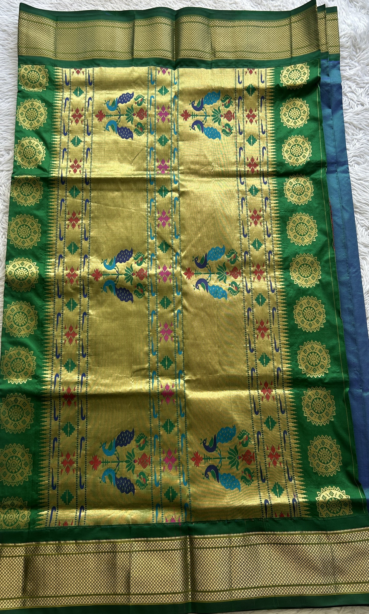 Narayanpet Silk Saree Peacock Blue Colored Complemented with a Green Zari Border.