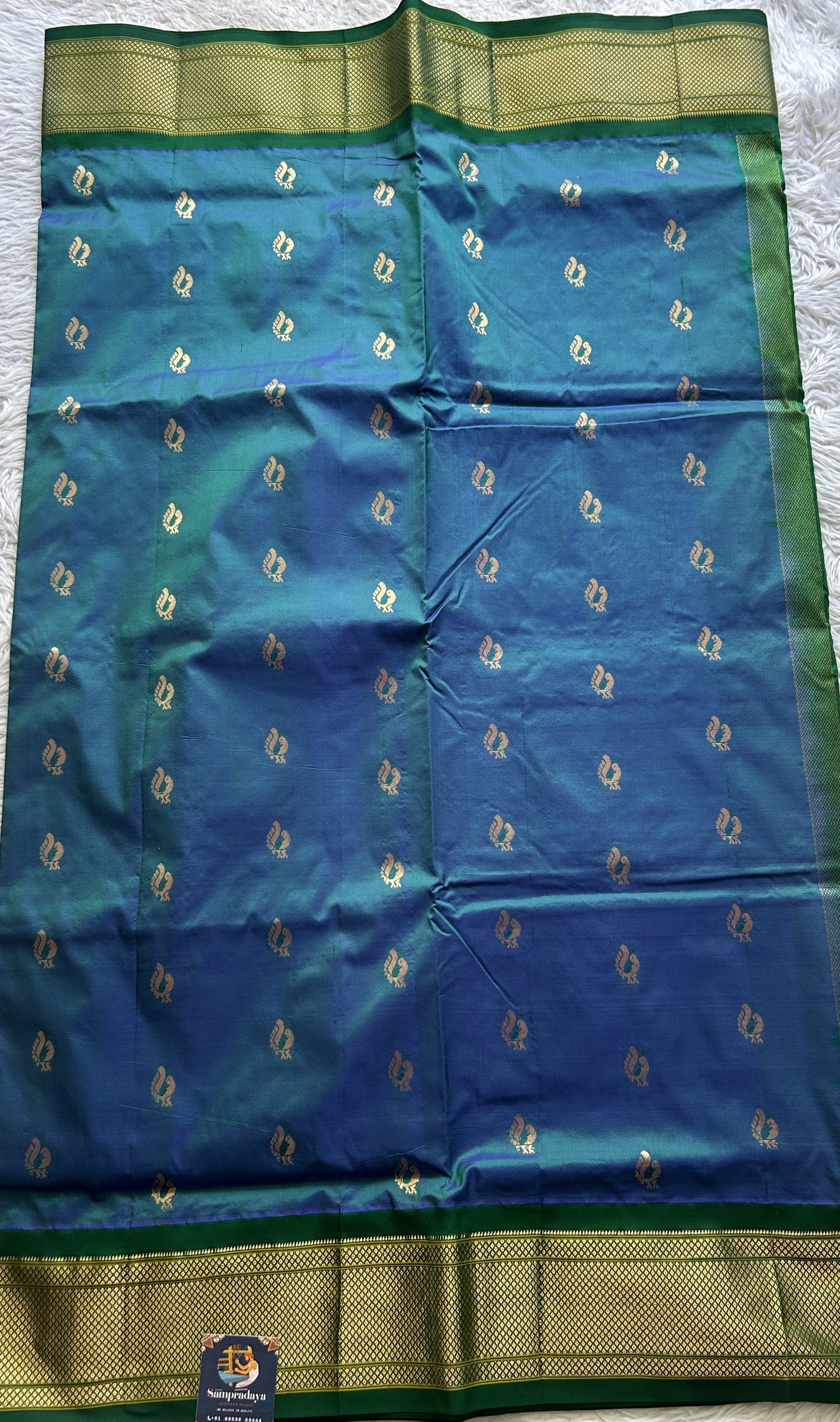 Narayanpet Silk Saree Peacock Blue Colored Complemented with a Green Zari Border.