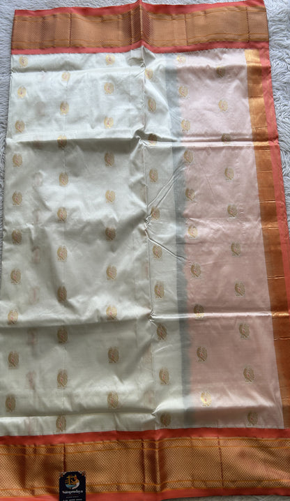 Narayanpet Silk Saree White Colored Complemented with a Peach Zari Border.