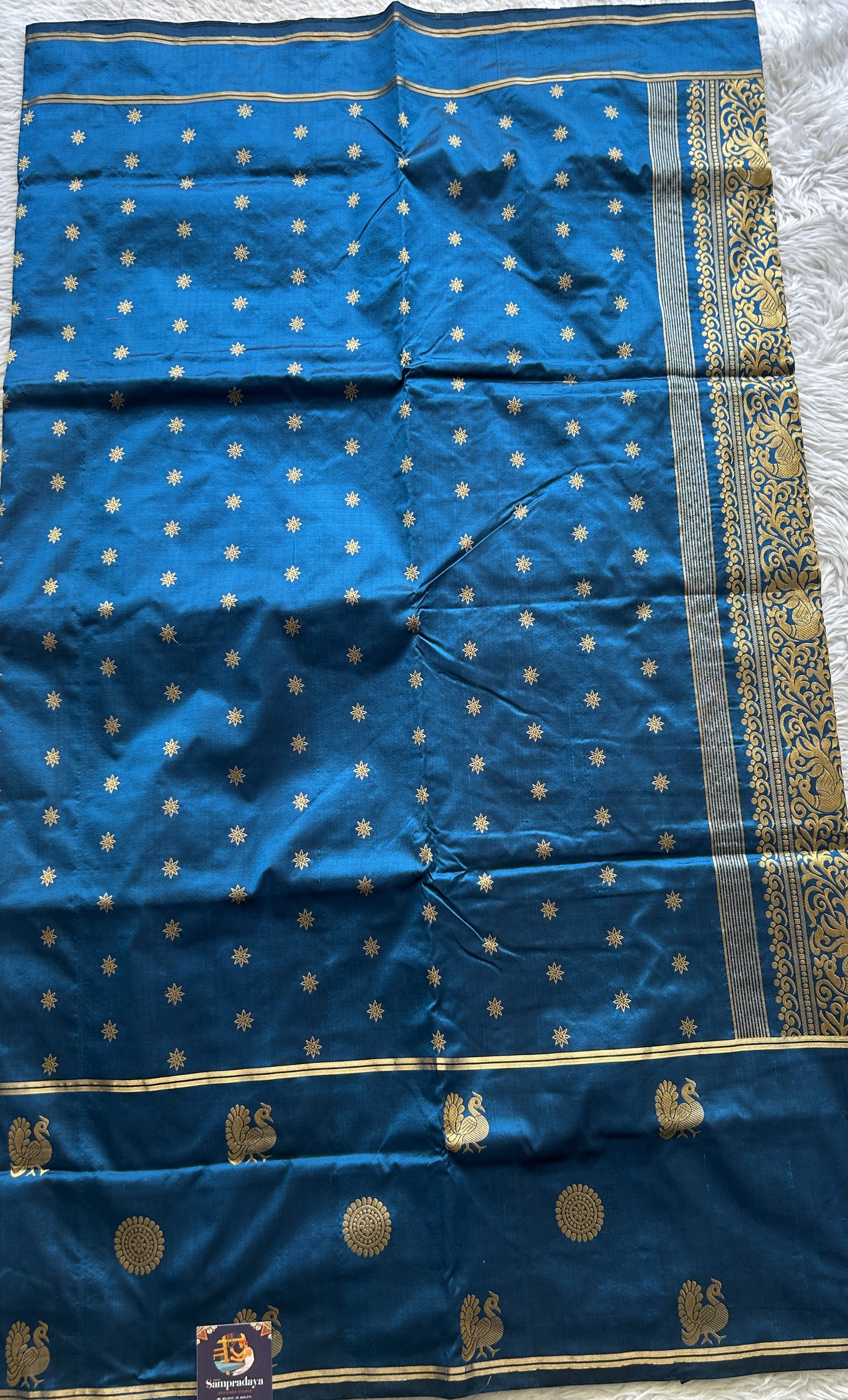 Narayanpet Silk Saree Peacock Blue Colored Complemented with a Buti Border.