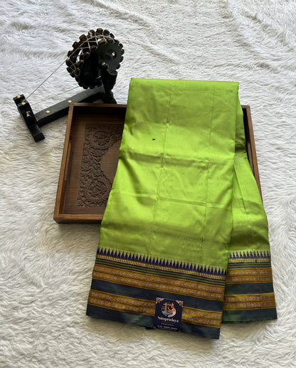 Narayanpet Silk Saree Parrot Green Colored Complemented with a Zari Border.