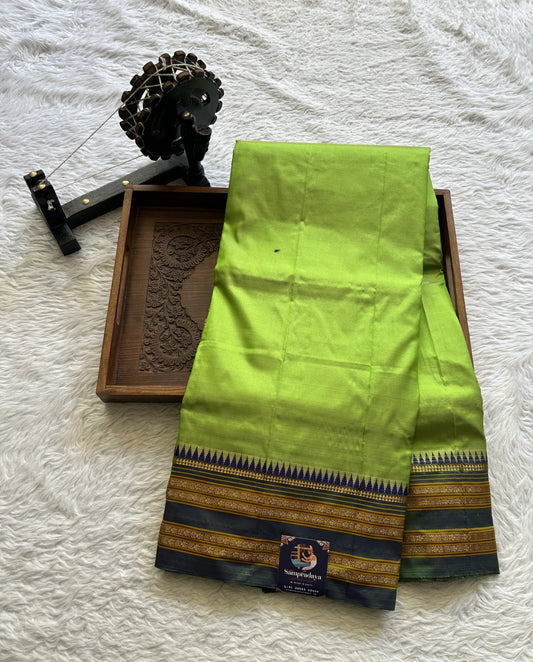 Narayanpet Silk Saree Parrot Green Colored Complemented with a Zari Border.