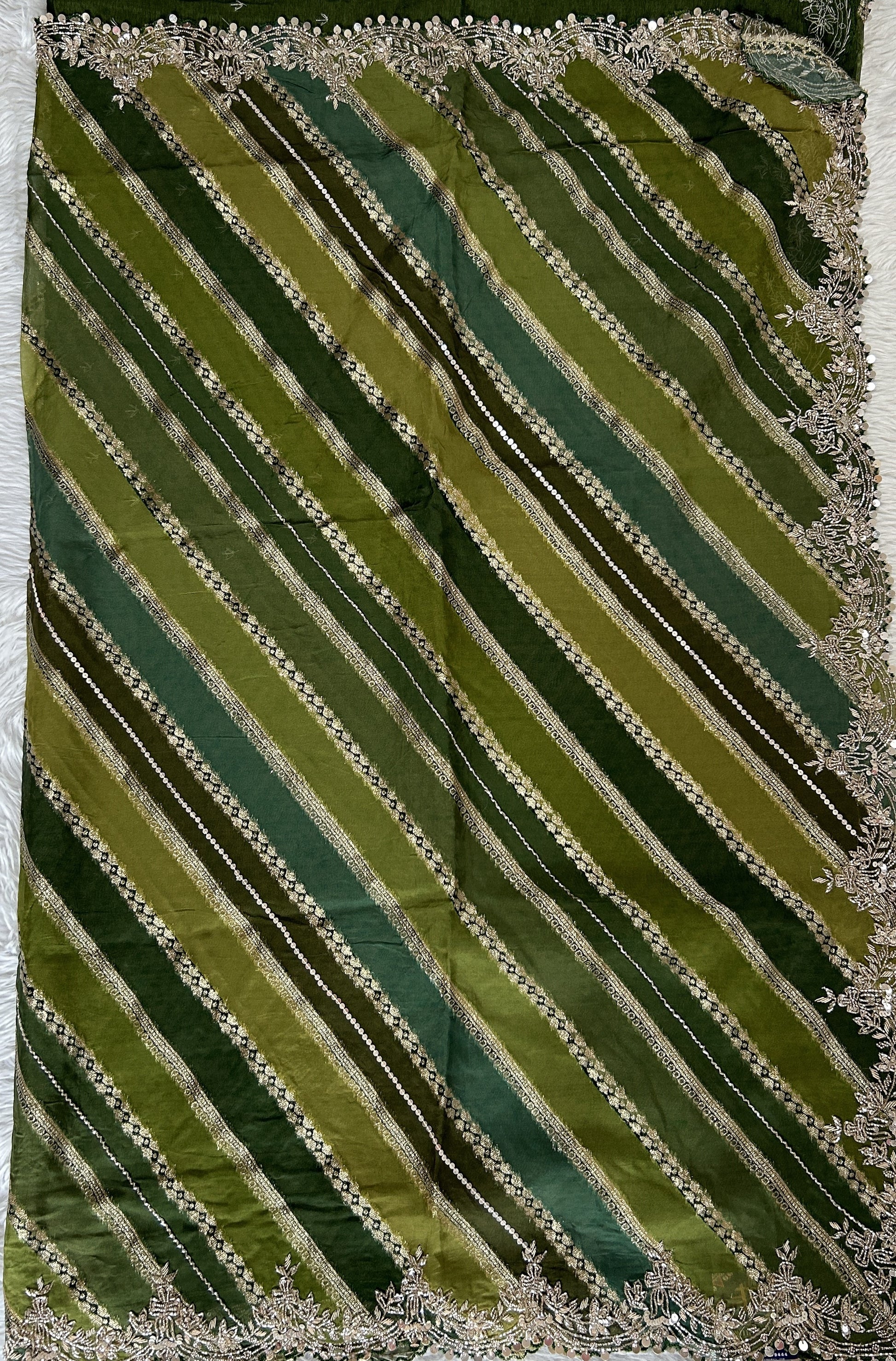 Banarasi Georgette Saree Green Colored Complemented with a Hand Embroidery border. - Sampradaya Designer Studio