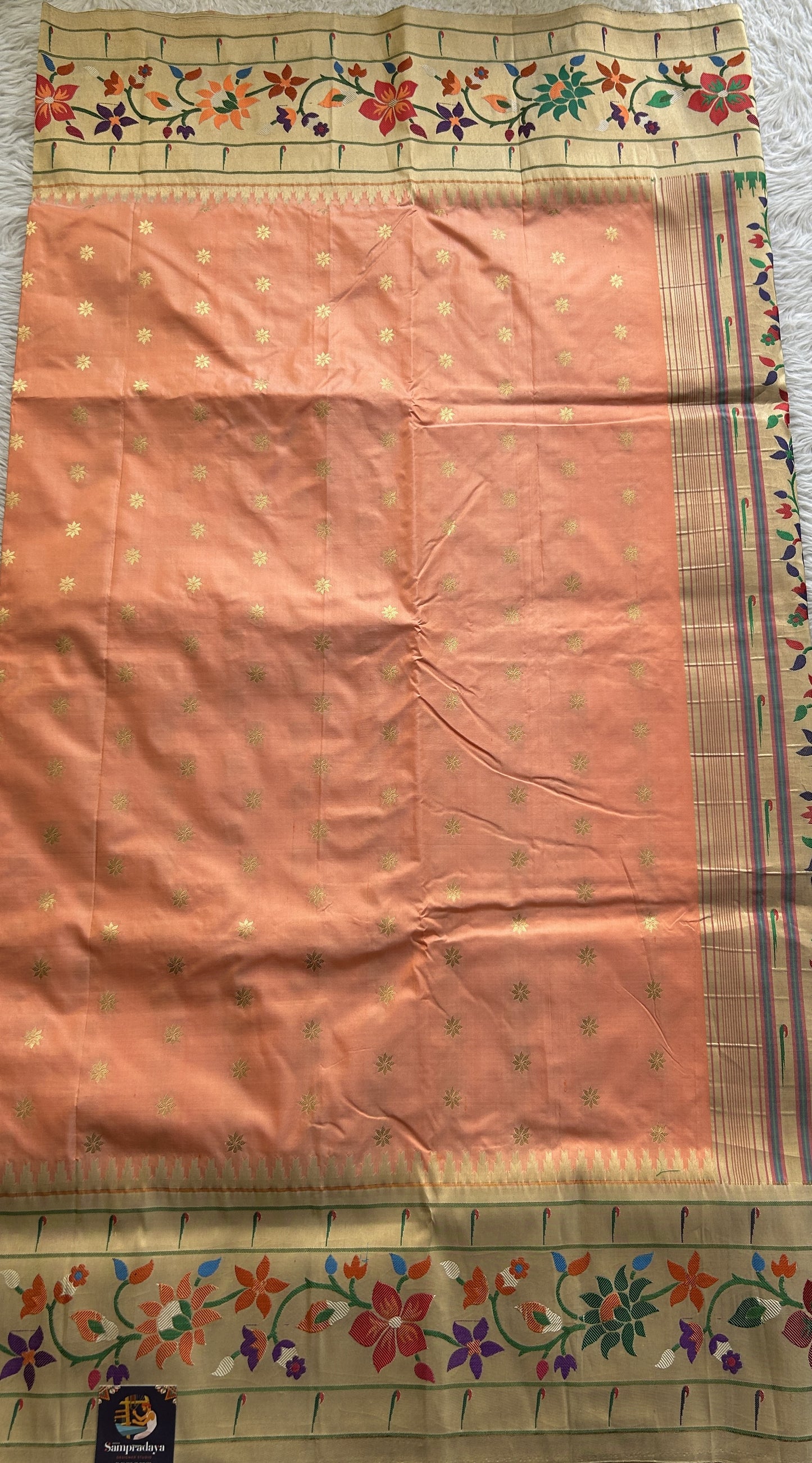 Narayanpet Silk Saree Peach Colored Complemented with a Paithani Border.