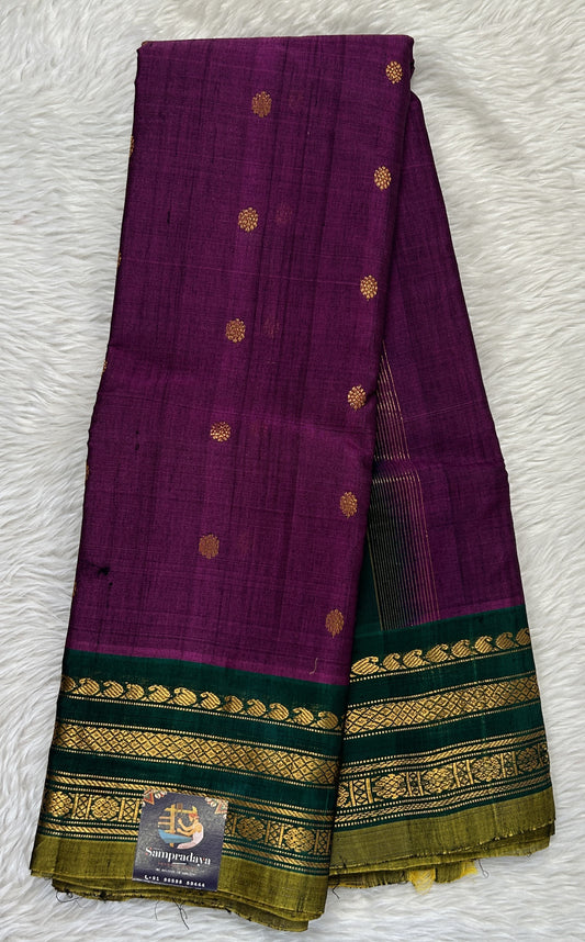 Gadwal Sico Saree Brinjal colored complemented with a Green Kanchi Gap Border. - Sampradaya Designer Studio