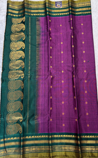 Gadwal Sico Saree Brinjal colored complemented with a Green Kanchi Gap Border. - Sampradaya Designer Studio