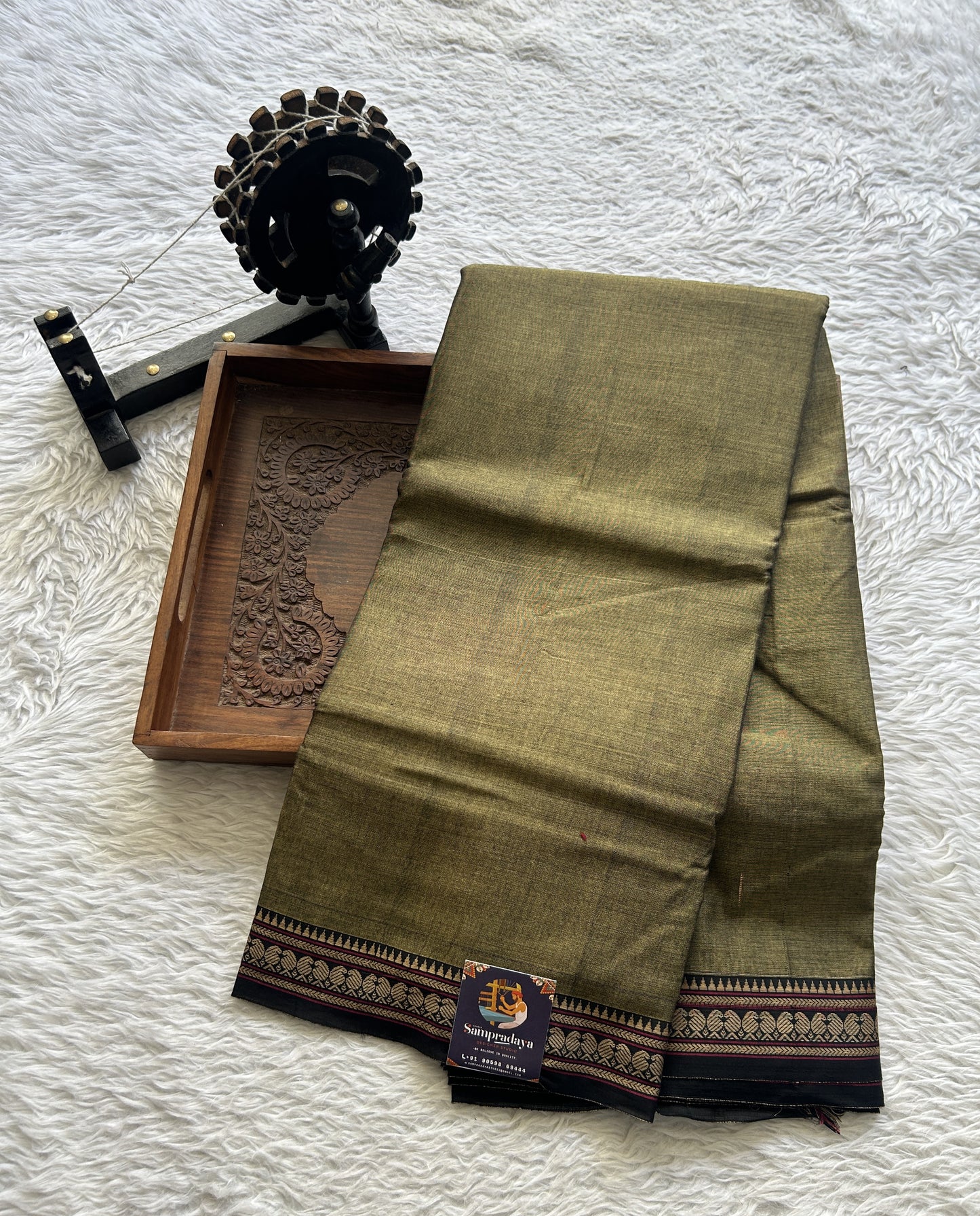 Narayanpet Cotton Saree Dark Olive Green Colored Complemented with a Thread Border.