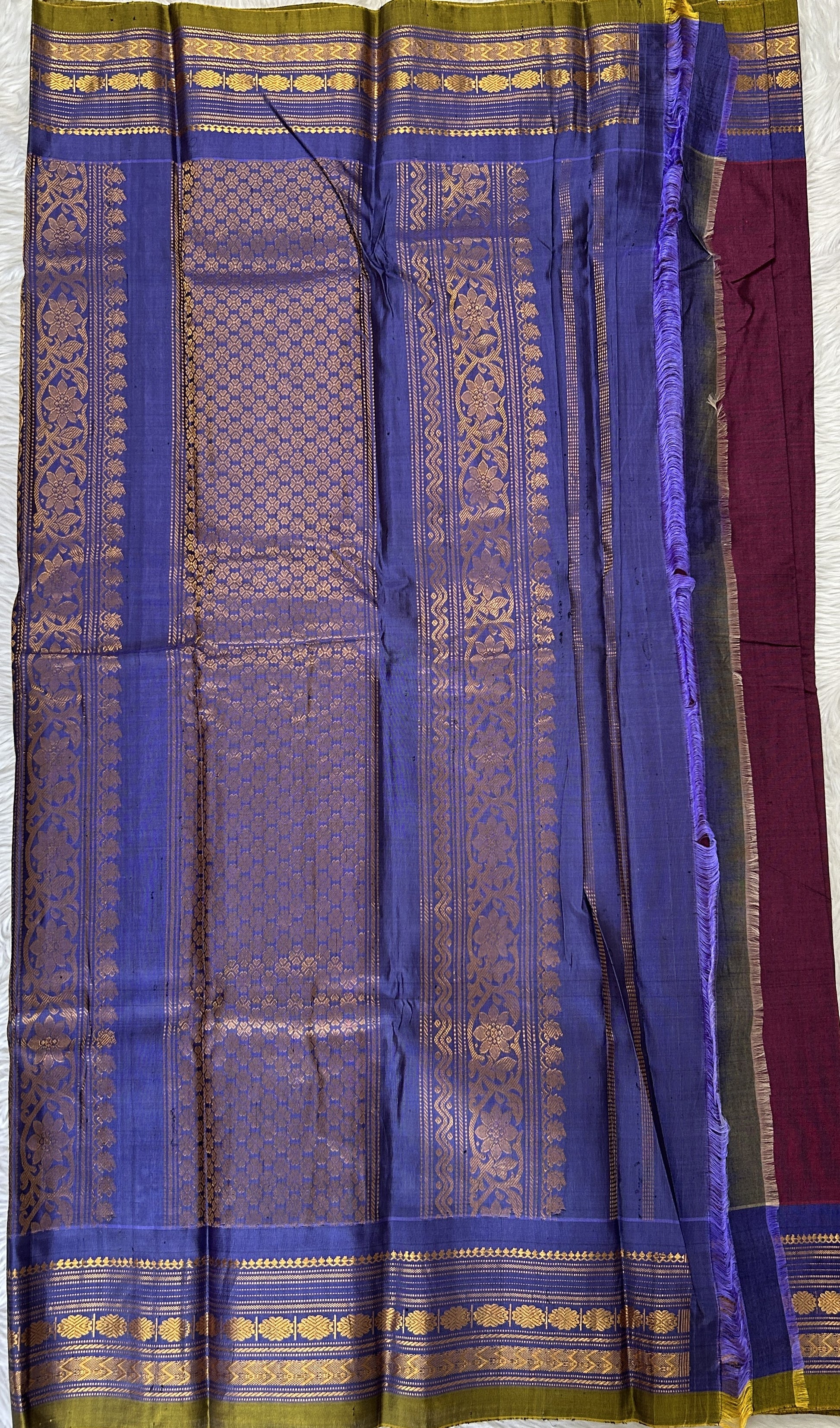 Gadwal Sico Saree Burgundy colored complemented with a Ink Blue Kanchi Gap Border. - Sampradaya Designer Studio