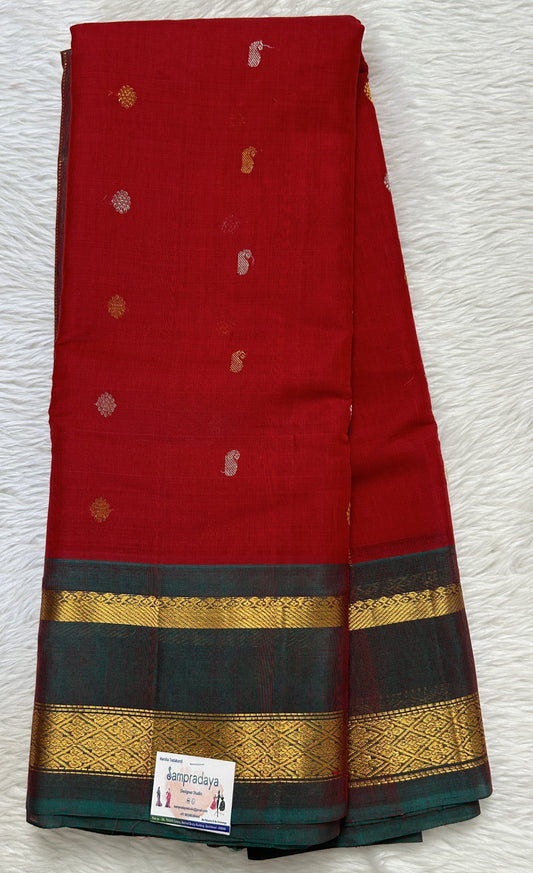 Gadwal Sico Saree Red colored complemented with a Bottle Green Kanchi Gap Border. - Sampradaya Designer Studio