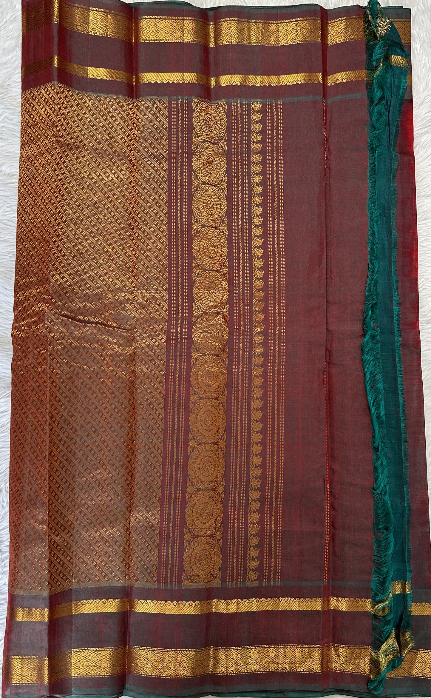 Gadwal Sico Saree Red colored complemented with a Bottle Green Kanchi Gap Border. - Sampradaya Designer Studio