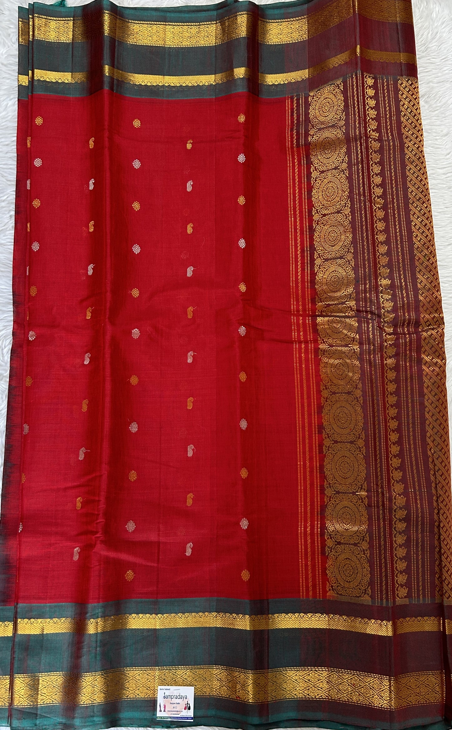 Gadwal Sico Saree Red colored complemented with a Bottle Green Kanchi Gap Border. - Sampradaya Designer Studio