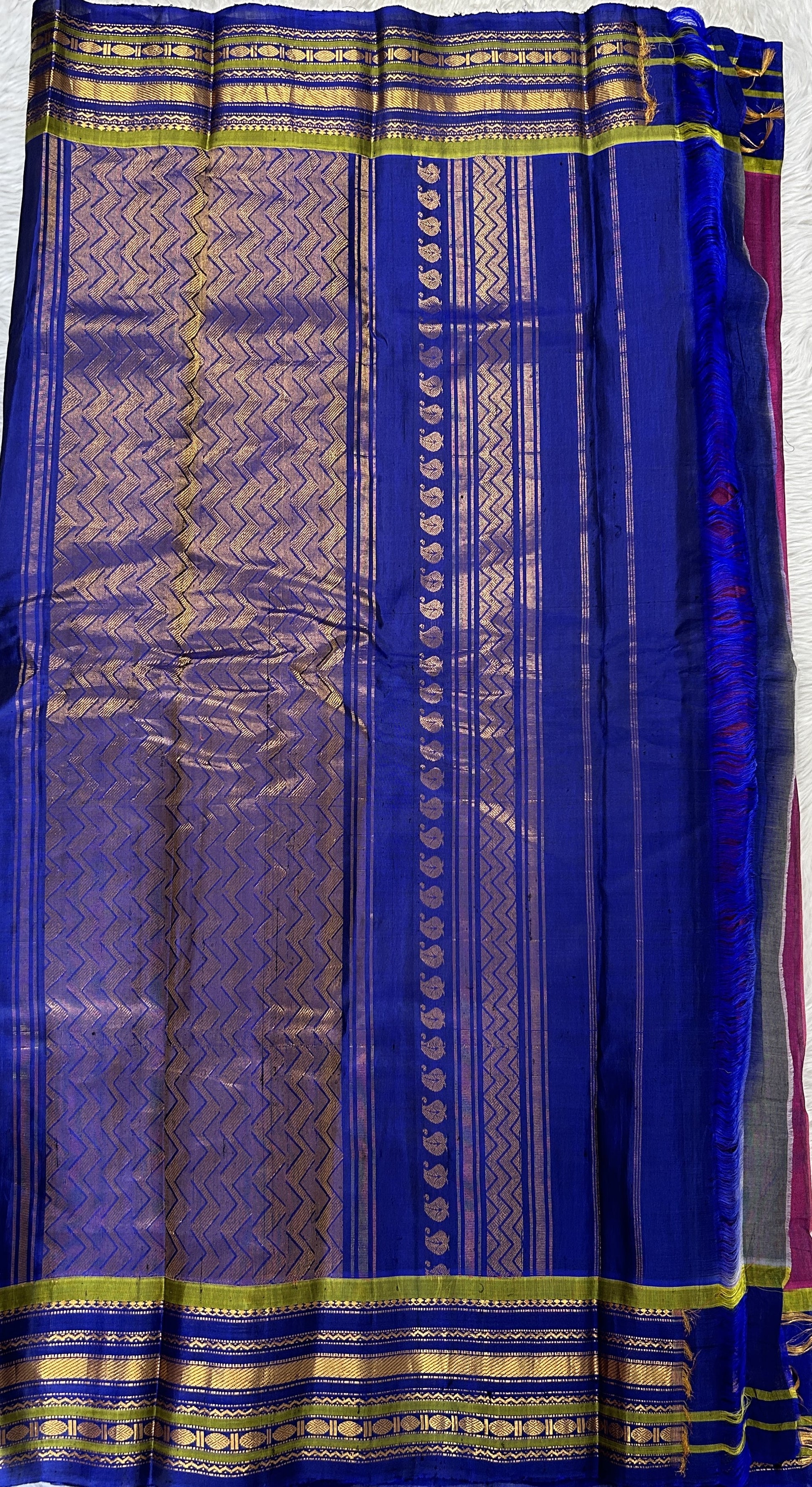 Gadwal Sico Saree Magenta colored complemented with a Ink Blue Kanchi Gap Border. - Sampradaya Designer Studio